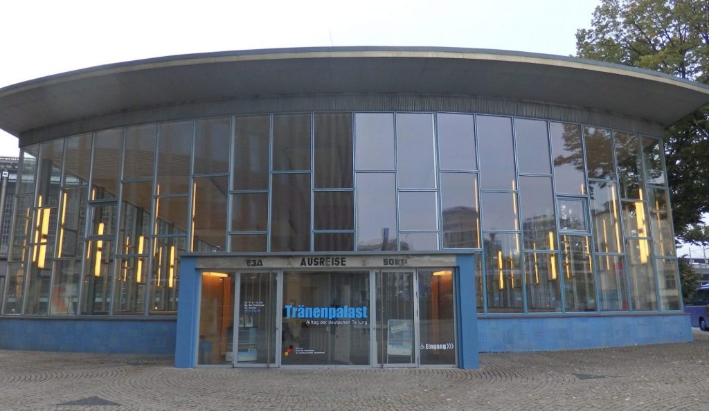 A rounded front of the building, with the entire front facade being panes of glass.