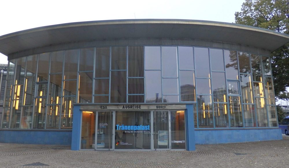 A rounded front of the building, with the entire front facade being panes of glass.