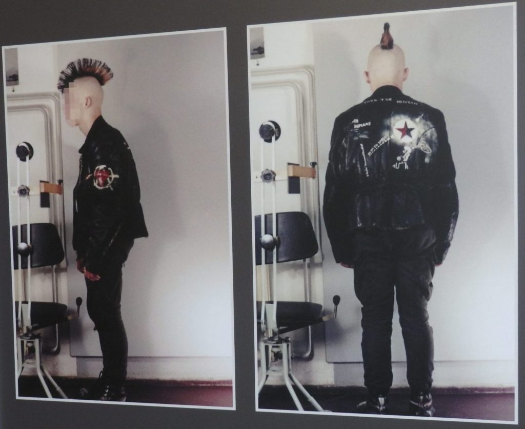 2 photos of a young man with his hair in a mohawk style. One from the side, one from the back.