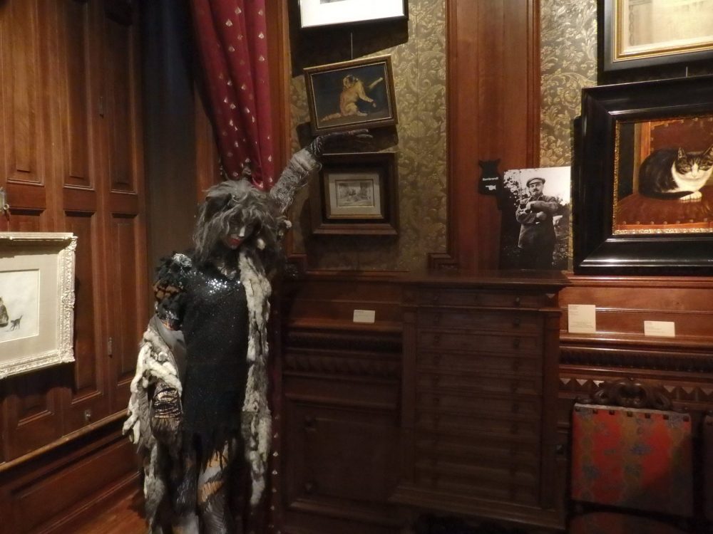 Just under the mannequin's left hand is a small etching by Rembrandt, in the Cat Cabinet in Amsterdam