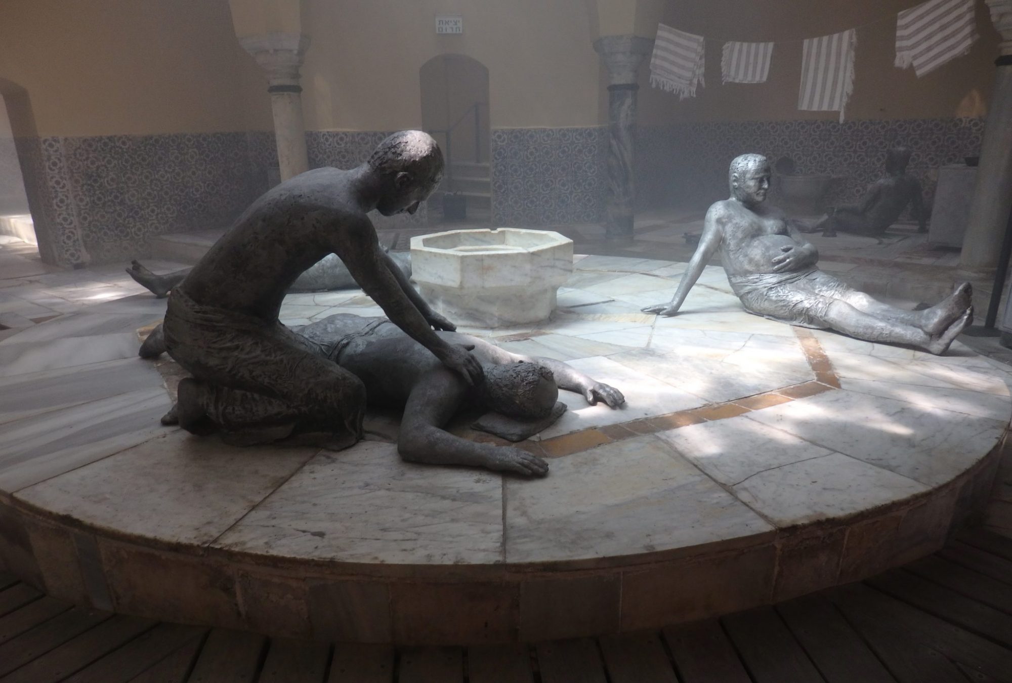 Inside the Turkish bathhouse in Akko old city, statues show what it might have looked like as men enjoyed the steambath or got a massage.
