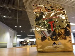 a bag of candy ready to hand to a flight attendant