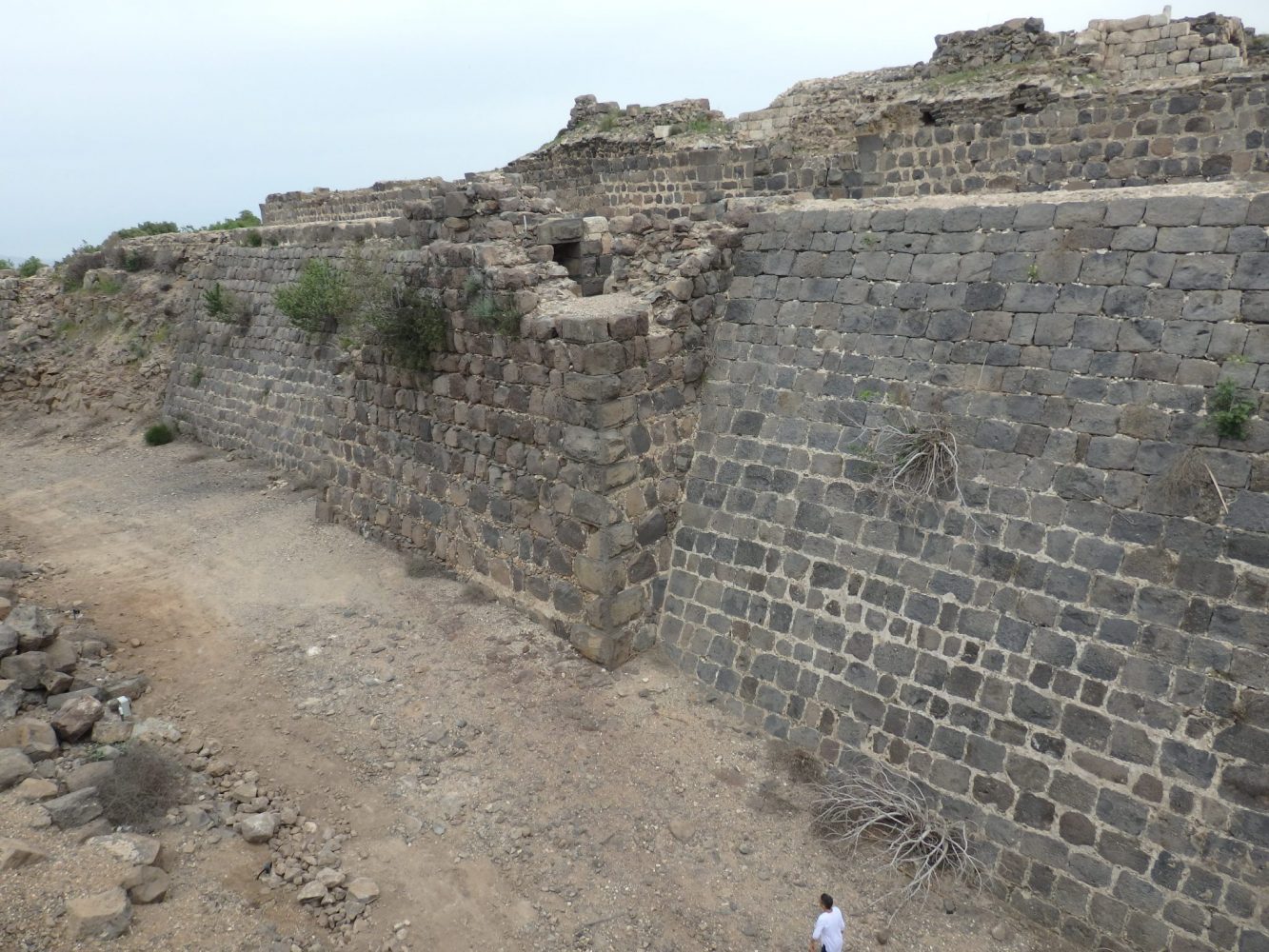 You'll notice a woman walking at the bottom of this picture. That gives you an idea of the depth of the moat and how steep the walls were. Belvoir Fortress, Israel.