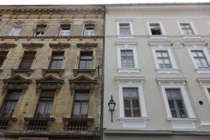 The contrast between these two buildings is remarkable. The one on the left is down to the underlying brickwork in places while the one on the right is pristine. What is not clear is how much the restoration on the right involved removing decorative elements. I suspect some plasterwork was removed, since the originals of this type generally have different window frames for each row, as you can see on the building on the left. Visiting Timisoara: faded glory