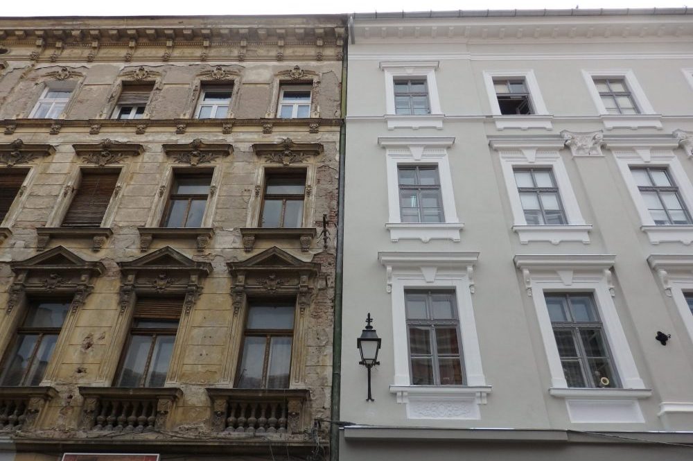 Look at the contrast between the unrestored building on the left and the restored one on the right. Faded Glory in TImisoara, Romania