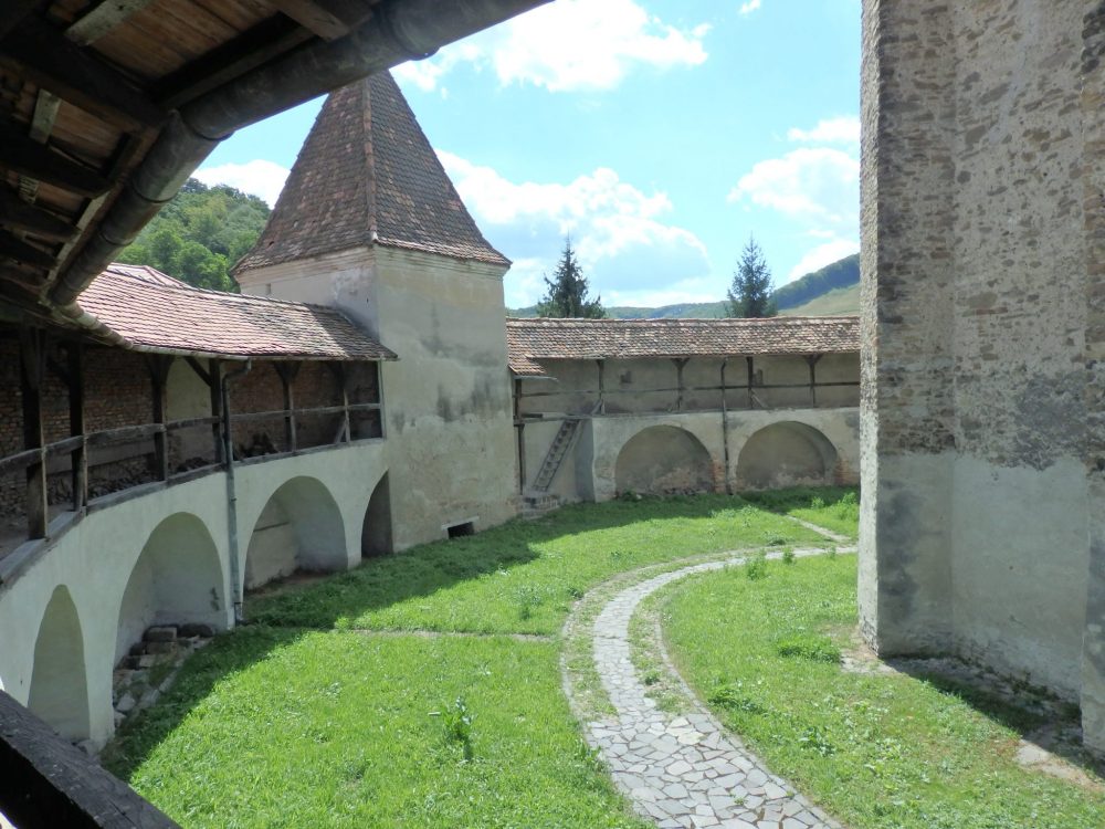 The defensive walls at Valea Viilor fortified church, with one of the guard towers.