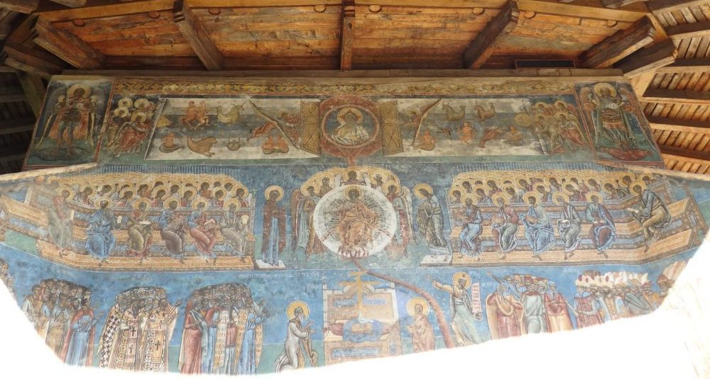 The top half of an entire wall dedicated to the Last Judgement. The bottom half was in full sunlight, so I couldn't get a picture of the whole thing. It's amazing that the colors have lasted so well. The Spectacular Painted Churches of Moldavia.
