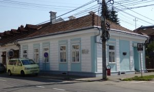 The Elie Wiesel Memorial is a single-story house on a street corner: quite small, painted white with blue around the windows.