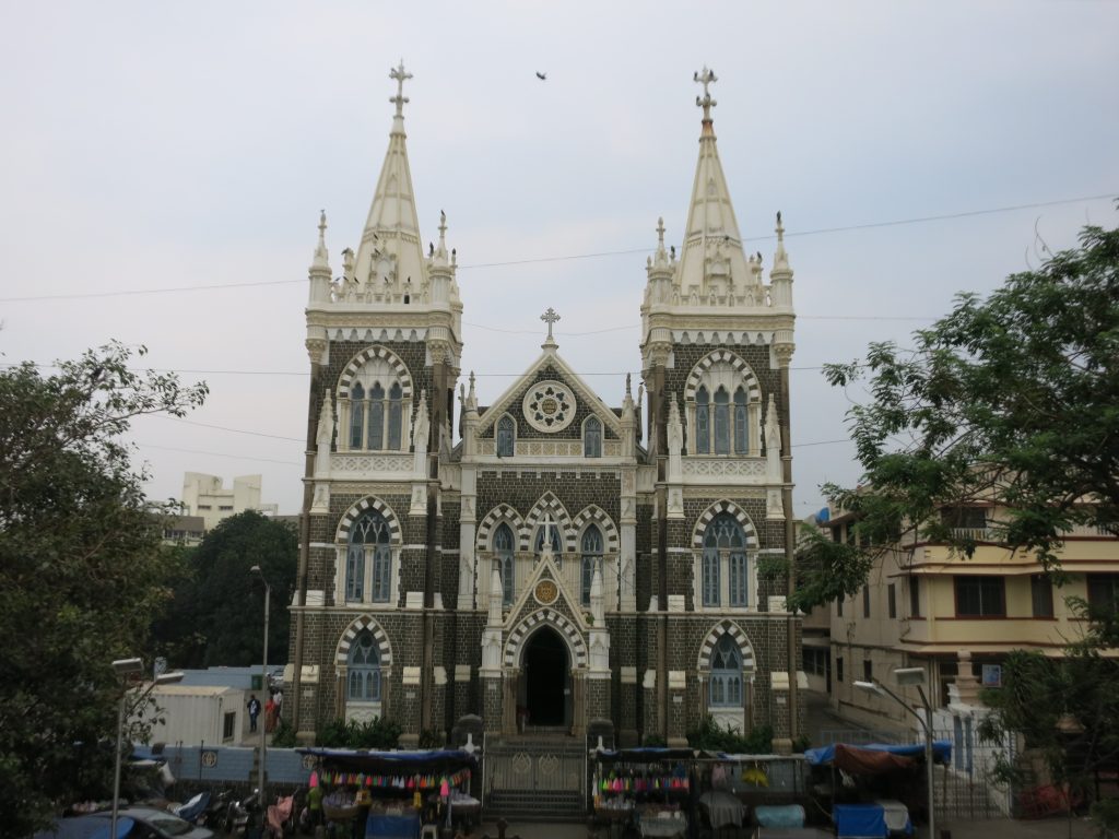 A large cathedral with two square towers on the sides.