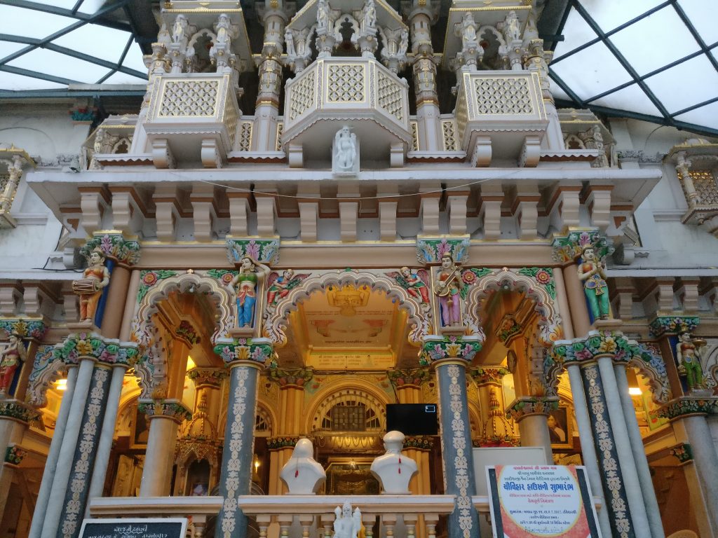 Very ornate entrance with arches, pillars and lots of decorative detail.