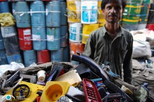 A plastics worker in Dharavi slum. Photo courtesy of Reality Tours.