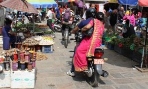 A motorcycle navigating a busy street in Kathmandu, Nepal.