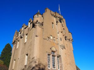 Looking up at a castle tower.