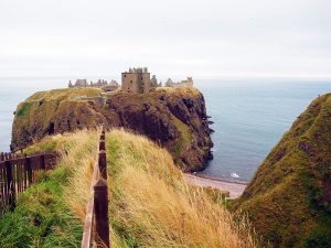 On a steep crag extending out into the sea are the ruins of the castle.