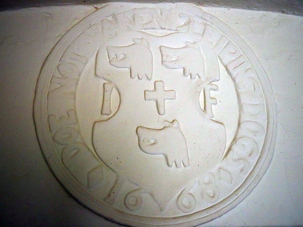 This coat of arms, from just inside the entrance to Craigievar Castle, says "Doe not waken slieping dogs." 