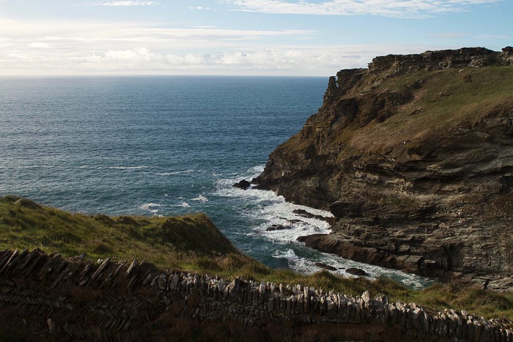 Craggy cliffs, blue sea.