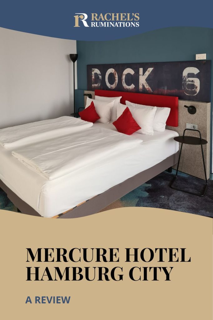 Text: Mercure Hotel Hamburg City: A review. Image: the bed, with the DOCK 6 sign above it.