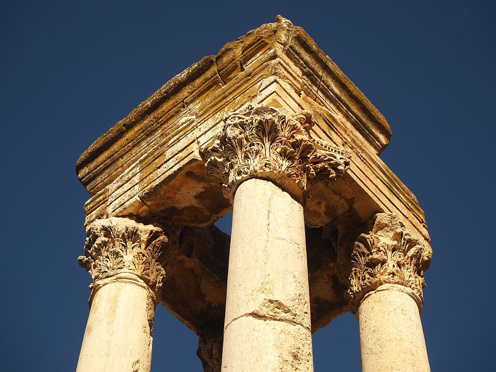 Four Corinthian columns support a square pediment at Anjar.