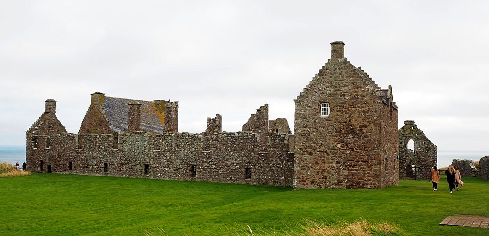 a wide, low stone building, mostly roofless, at Dunnottar Castle.