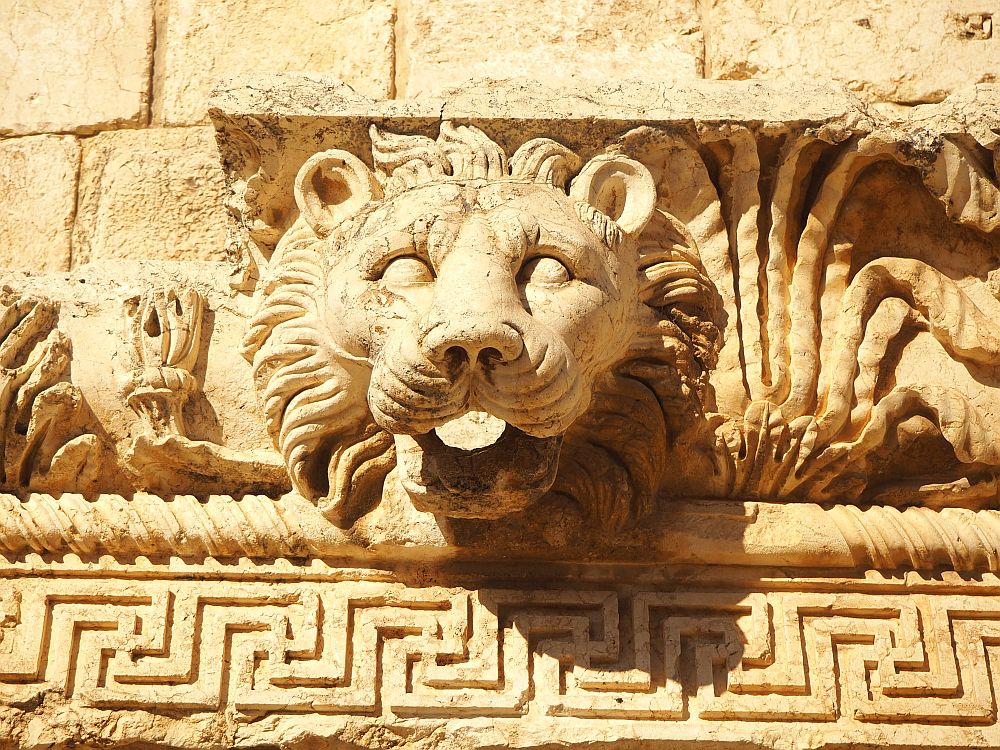 This lion's head extends out of a decoratively carved stone. I think it might have been a gargoyle to drain rainwater from the roof.