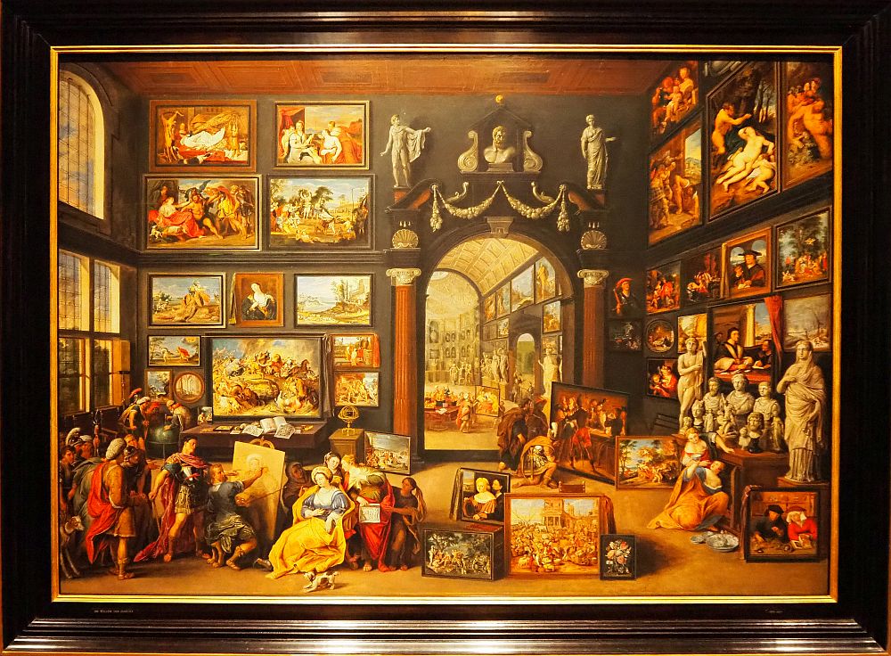 The painting shows an artist painting a portrait in a huge room whose walls are covered with paintings, done in remarkable detail.