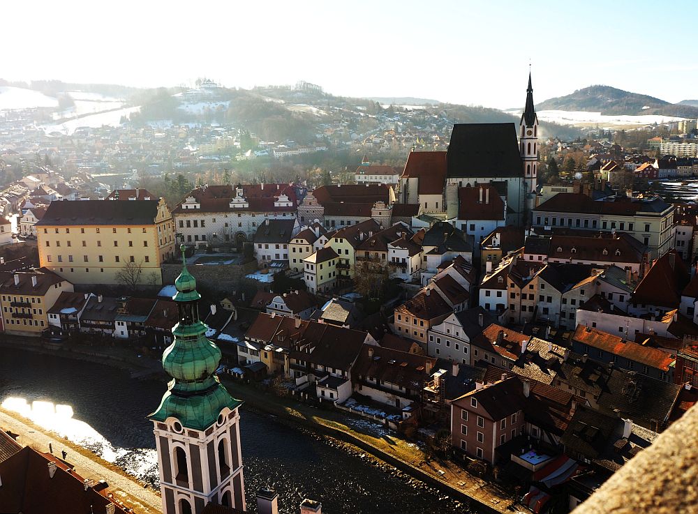 The town from here looks like a crowded huddle of small buildings, with St. Vitus Church above them.