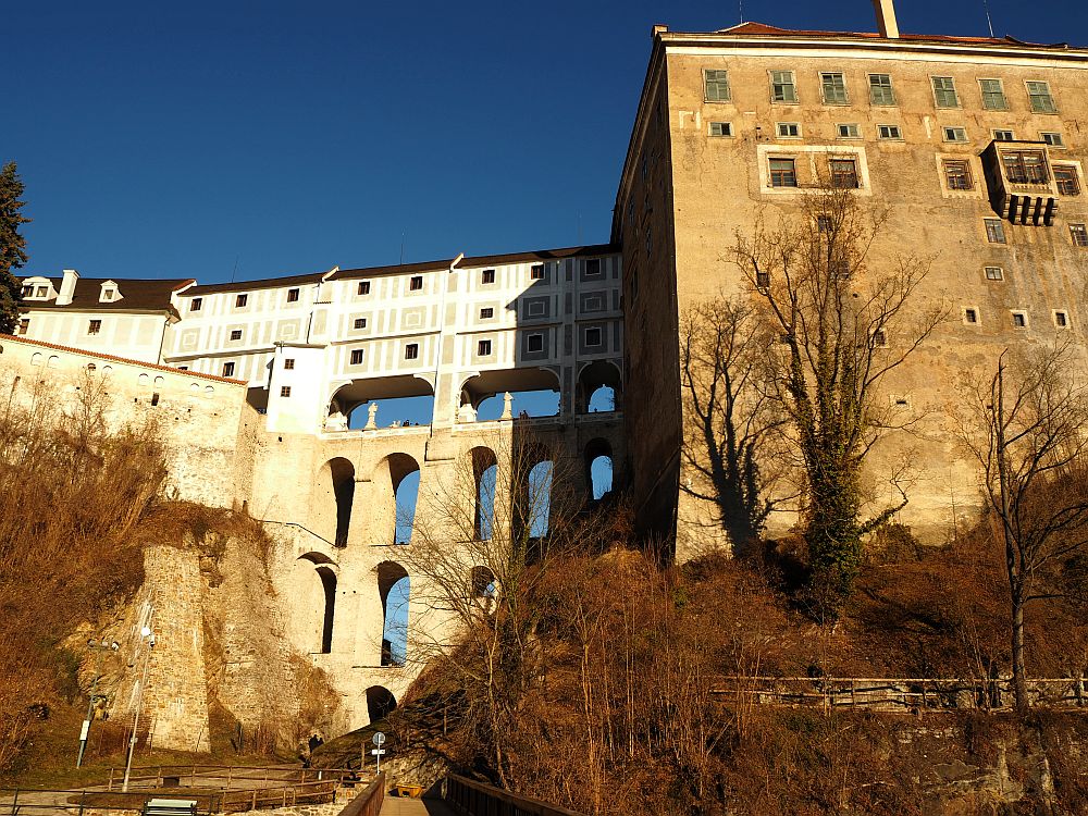 The bridges form arches over the cleft, each bridge built on top of the one below. The top two stories are enclosed while the underneath ones are open to the air.