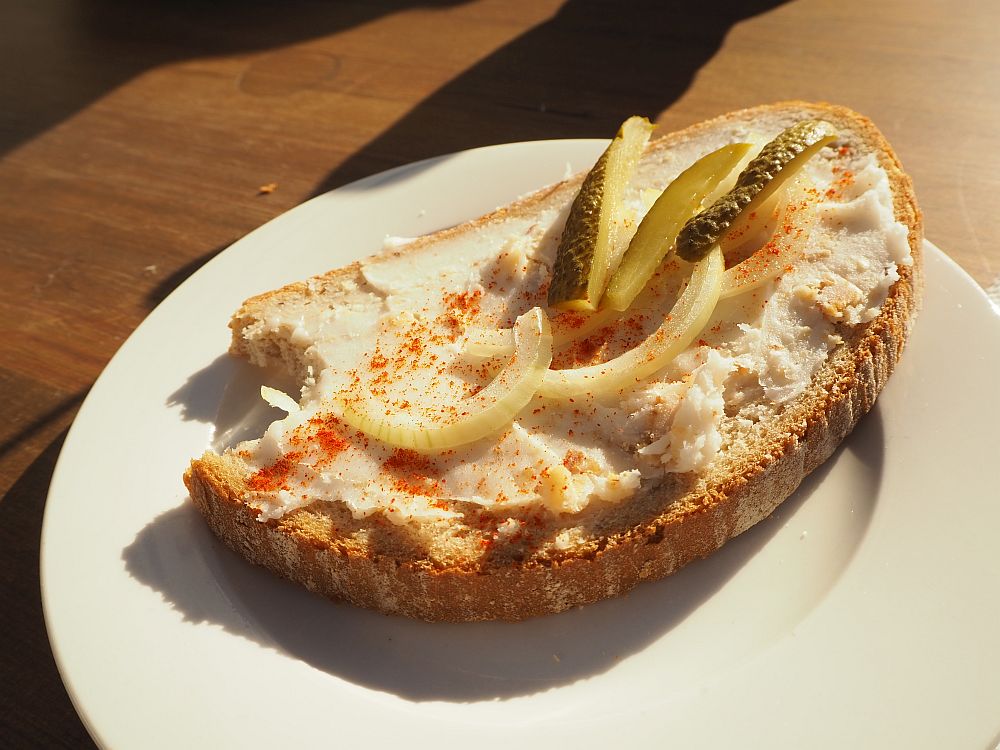 open-face sandwich with pork fat, pickles and onions