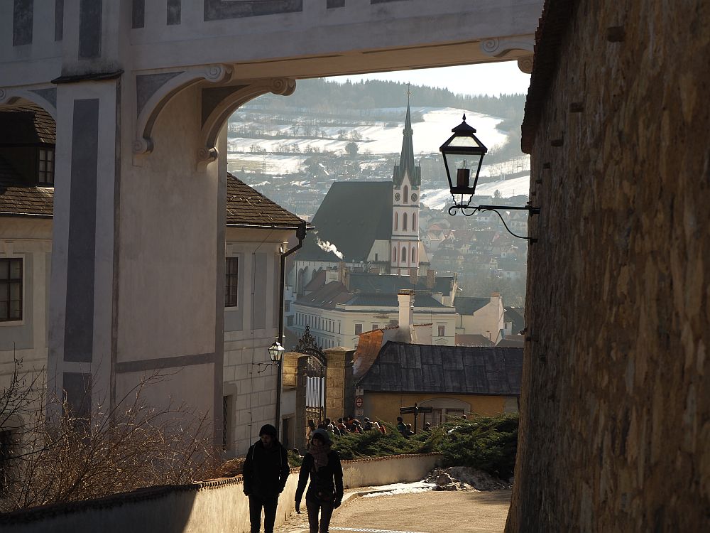 Under the bridges archway, the town is visible in the distance.