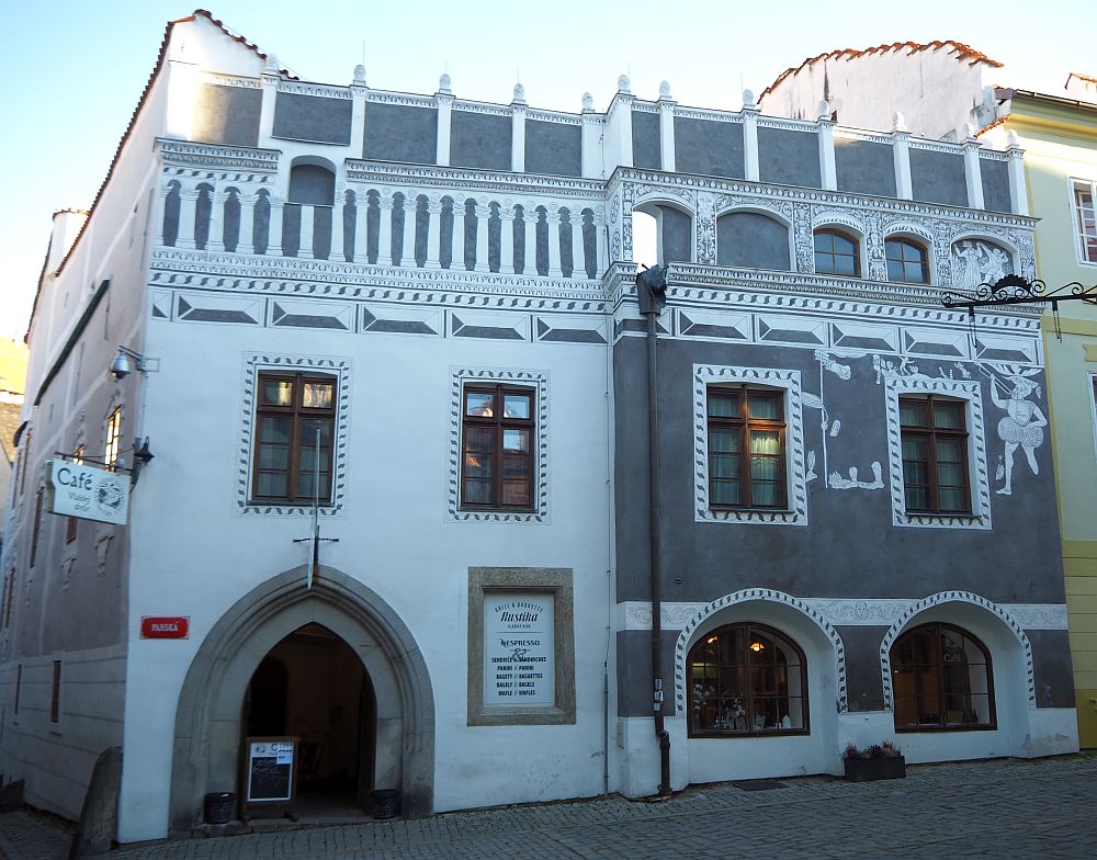 Two buildings with stucco images.