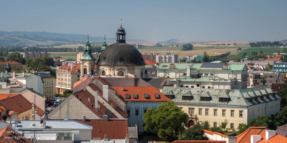 A jumble of buildings, with a domed cupola in the middle distance