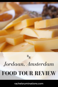 Pinnable image: Text: Jordaan, Amsterdam Food Tour Review Image: close-up of blocks of cheese