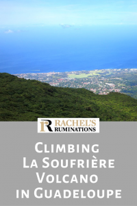 Pinnable image Text: Climbing La Soufriere Volcano in Guadeloupe Image: a view down over land and villages far below and the very blue sea beyond, blending with the blue sky.