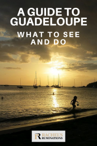 Pinnable image
Text: A guide to Guadeloupe: What to see and do
Image: Sunset at a beach. Gentle waves in the foreground and the sillhouette of a child running, carrying a pail. On the horizon, silhouettes of moored sailboats. The sun is low in the sky and shines orange through the cloud layer.