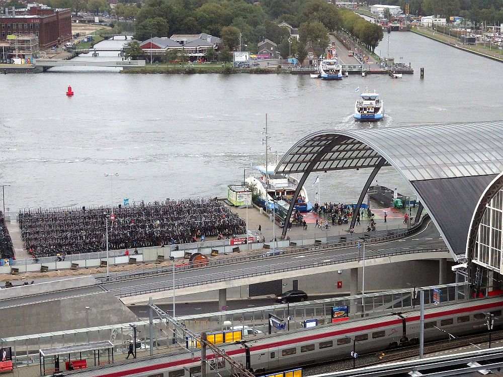 The central station with the river behind it - a ferry crossing the river.