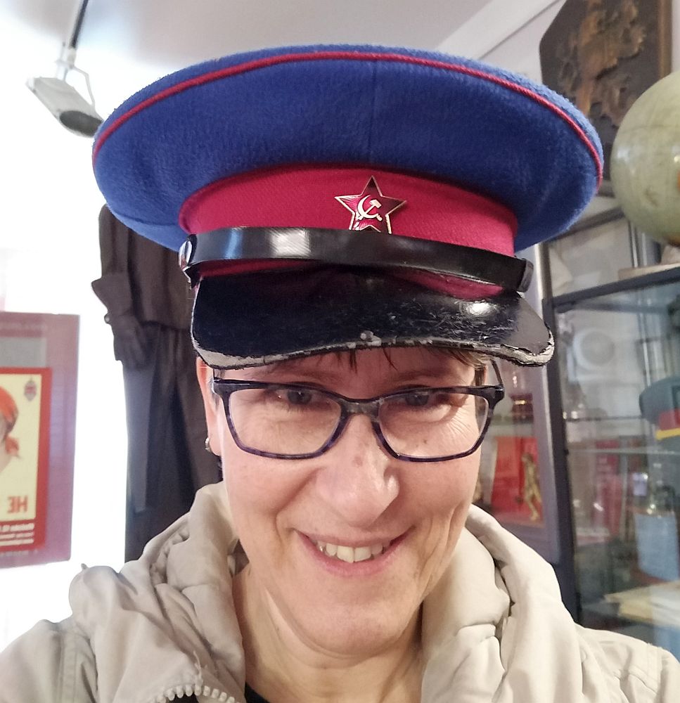 This is a head shot of me wearing an army cap that has the red star with a hammer and sickle above the brim. This guy was far too enthusiastic about communism in Prague!