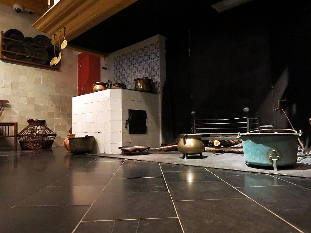 Taken from near the floor, a part of the hearth is visible, with cooking pans.