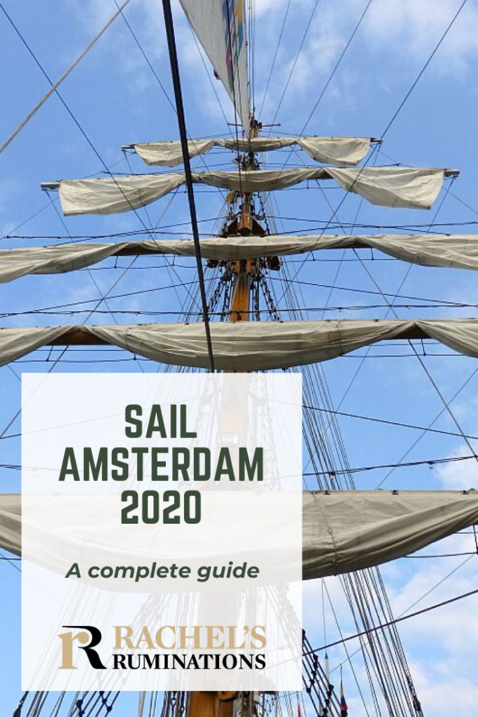 Pinnable image Photo: Looking up at a tall ship mast with five sails, furled on horizontal beams, one above the other. Text: SAIL Amsterdam 2020: A complete guide (and Rachel's Ruminations logo)