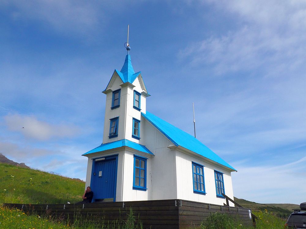 A particularly pretty church: A simple design, but the walls are white, while the roof, the door and the window frames are bright blue. the steeple is unusual in that it's a bit taller than on most Icelandic churchs and has two levels of windows in it above the ground level.