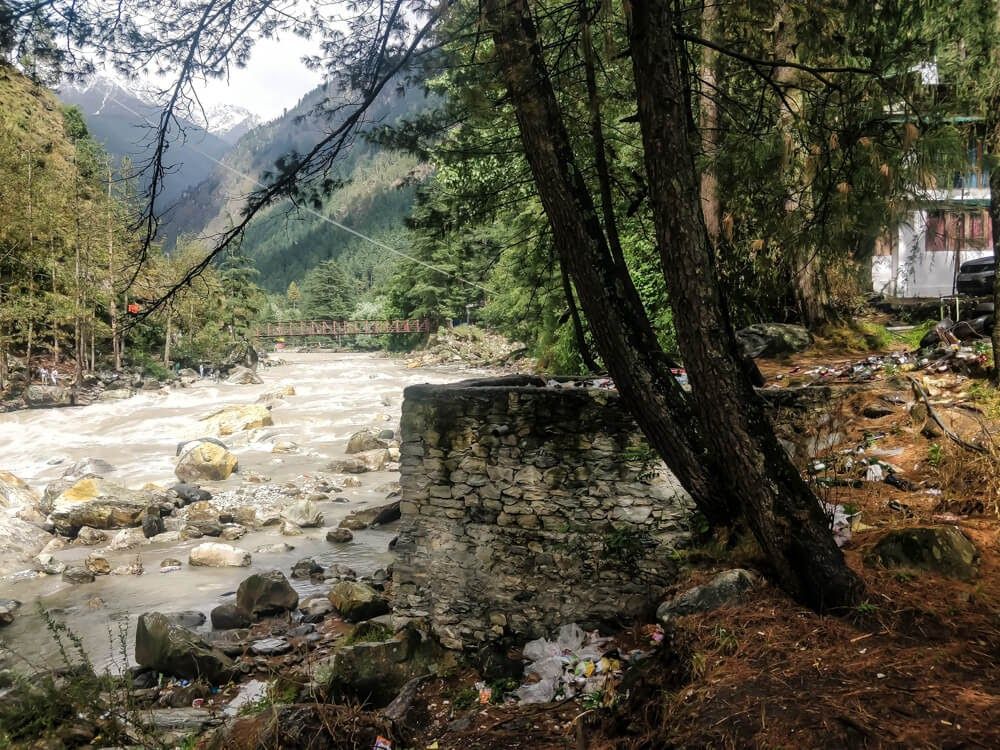 A view from a riverbank, looking down the river. 