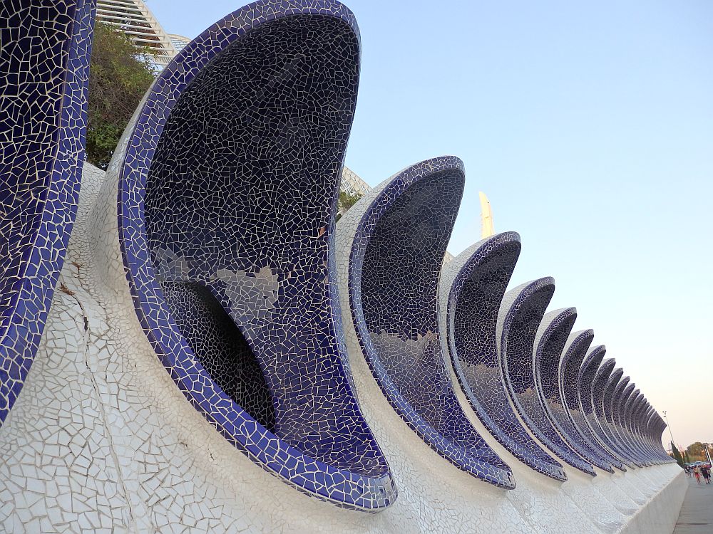 A row of vents going a long way into the distance. They are all covered in blue mosaic and look, as I said in the text, like large urinals.