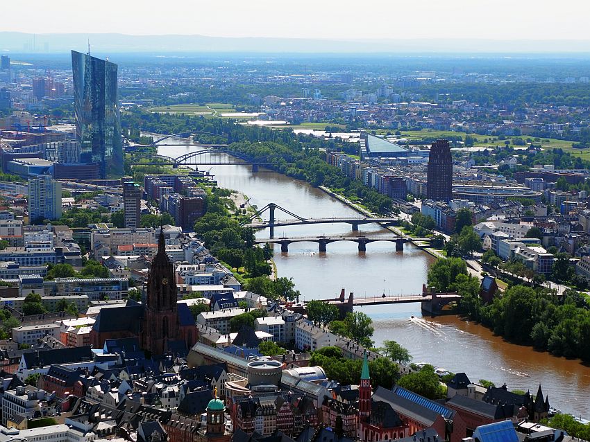 In this view over the city, the river runs diagonally from bottom right to top left. Top left is the tall European Central Bank building, a parallelogram rather than a rectangle. The Cathedral also stands above the buildings around it in the middle distance.