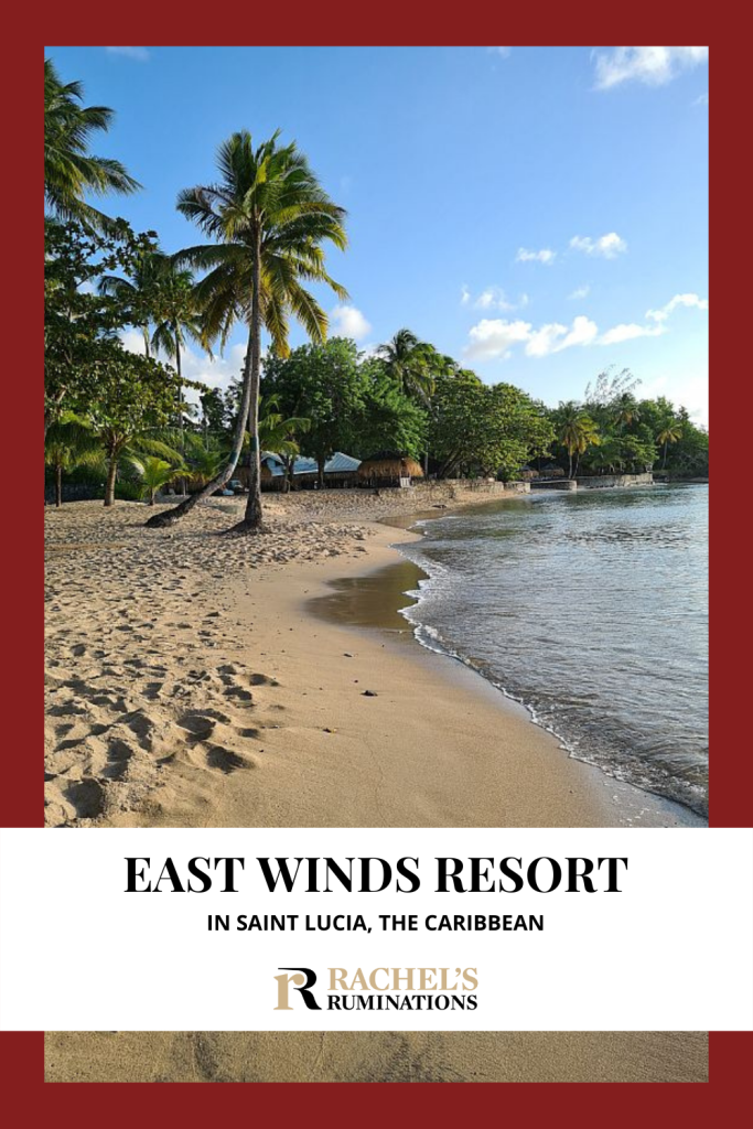 Text: East Winds Resort in Saint Lucia, the Caribbean (and the Rachel's Ruminations logo). Image, the view down the beach at East Winds.