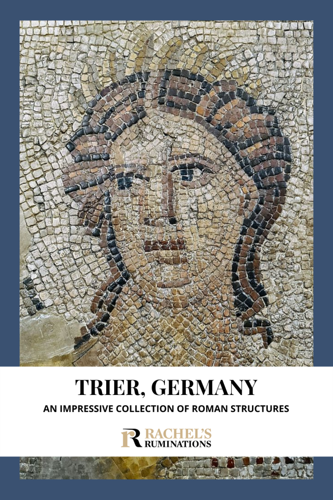 Text: Trier, Germany: An impressive collection of Roman structures (and the Rachel's Ruminations logo). Image: a person's face, made in mosaic.