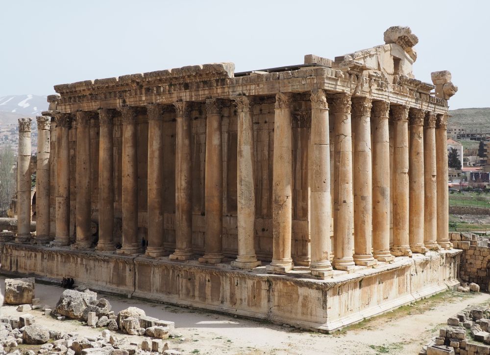 A large rectangular structure with pillars lining the sides, supporting a portico. 