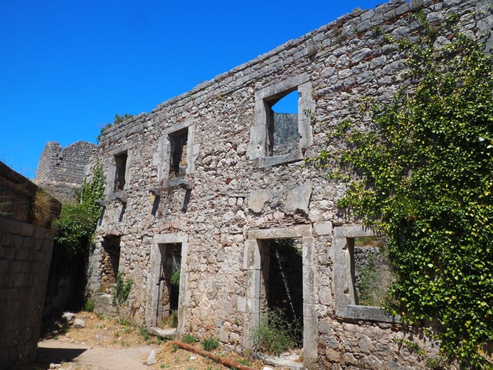 At San Giovanni Fortress, a two-storey stone building, roofless, with gaping windows without glass.