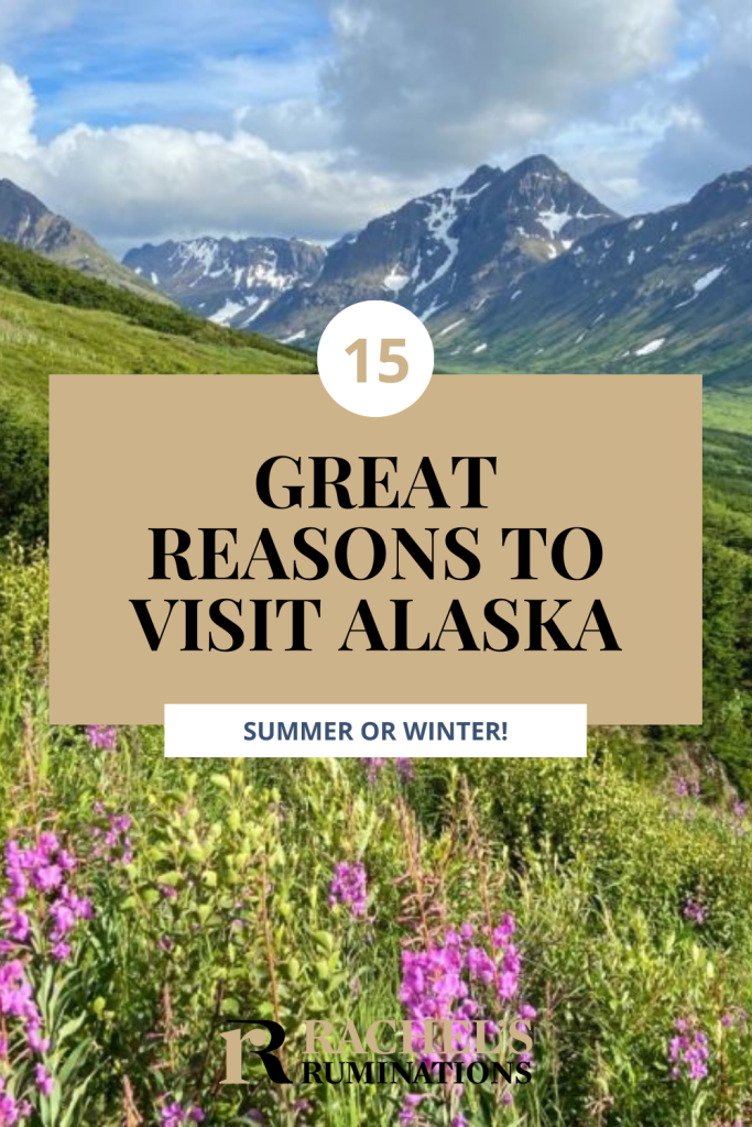 Text: 15 great reasons to visit Alaska: summer or winter! Image: a view over a meadow to a view of snow-capped mountains.