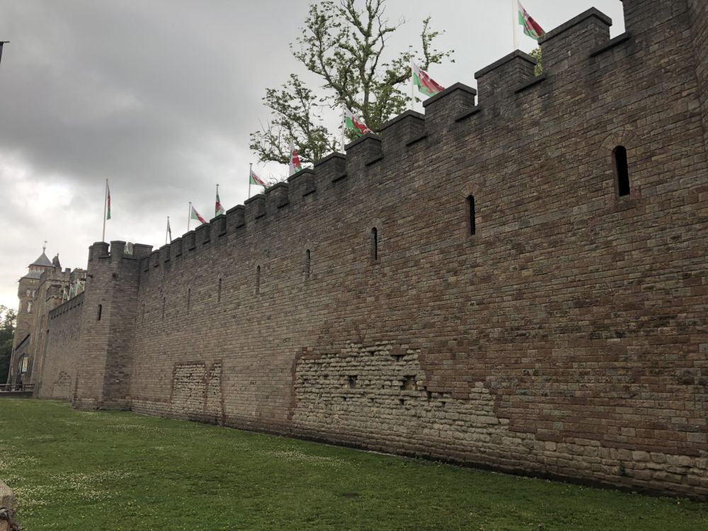 Sighting along the crenellated wall of Cardiff Castle with, in the distance, some of the castle building itself.