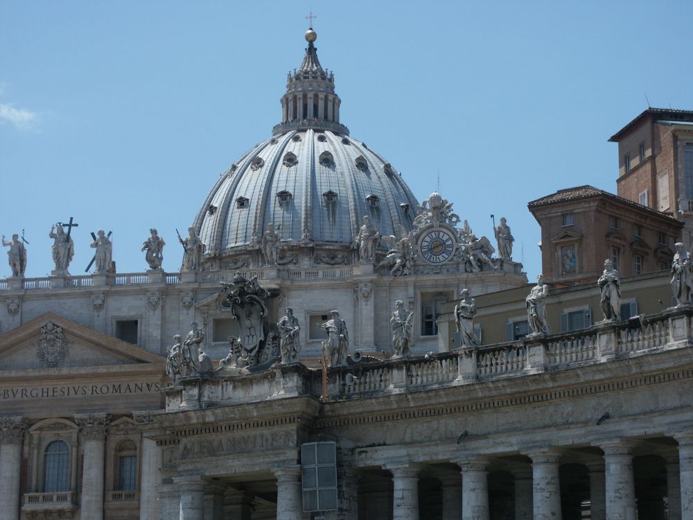 St. Peter's Basilica dome, with rows of statues along its base. Of the historic sites in Rome, this one is the most ornate and will take the most time to see.