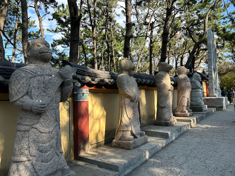 The zodiac statues at Haedong Yonggungsa Temple in Busan are stone statues, standing like humans but with animal faces.